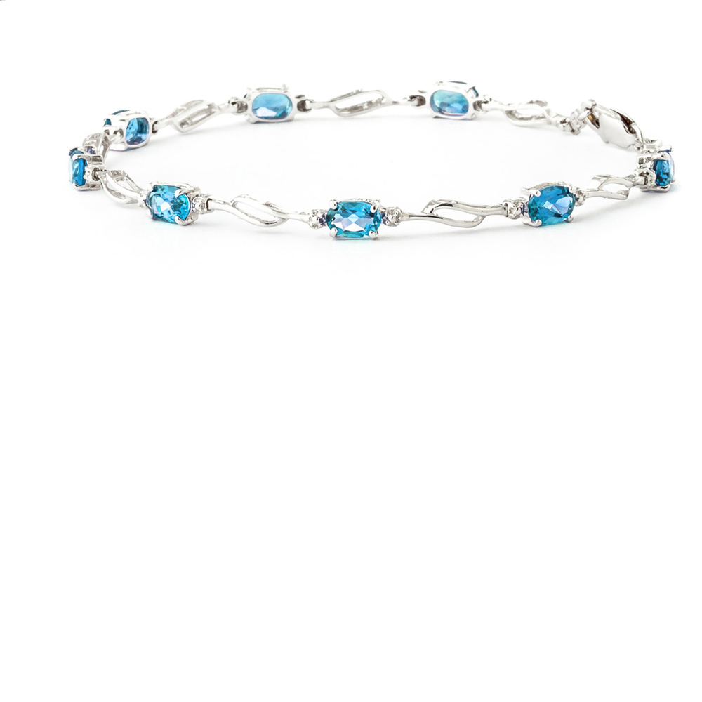 14K. GOLD TENNIS BRACELET WITH BLUE TOPAZ & DIAMONDS (White Gold) - Picture 1 of 6